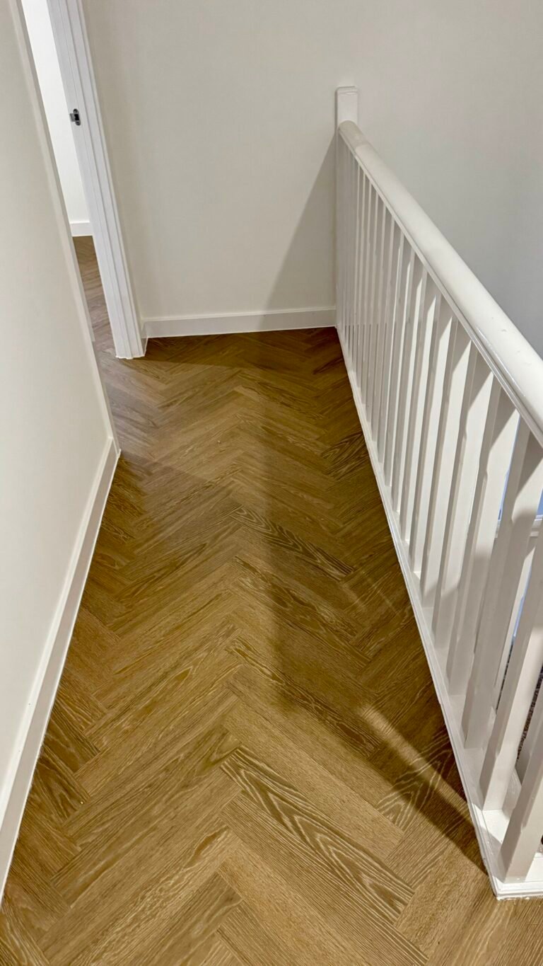Oak herringbone LVT fitted on an upstairs landing