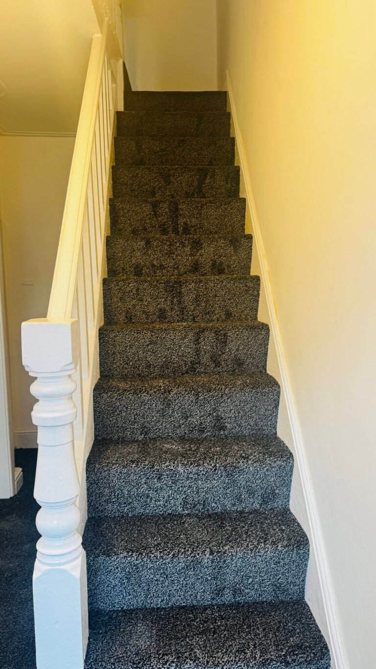 Charcoal flecked carpet fitted on a straight staircase