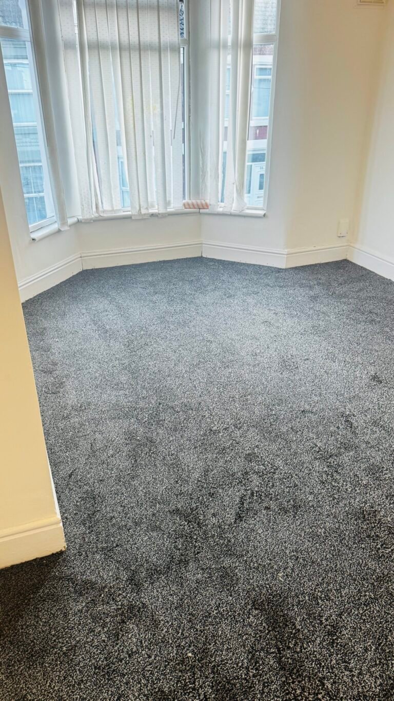 Charcoal flecked carpet fitted in a bay-window lounge in Liverpool