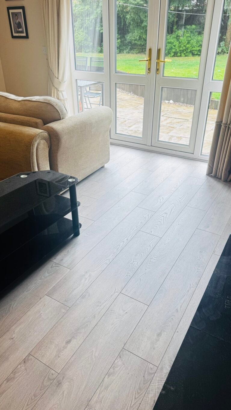 Light grey oak laminate fitted in a lounge with French doors