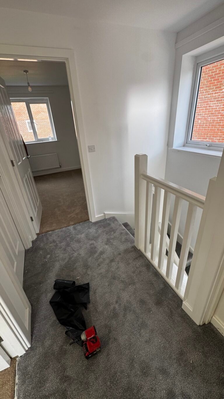 Grey carpet fitted on an upstairs landing and stairs