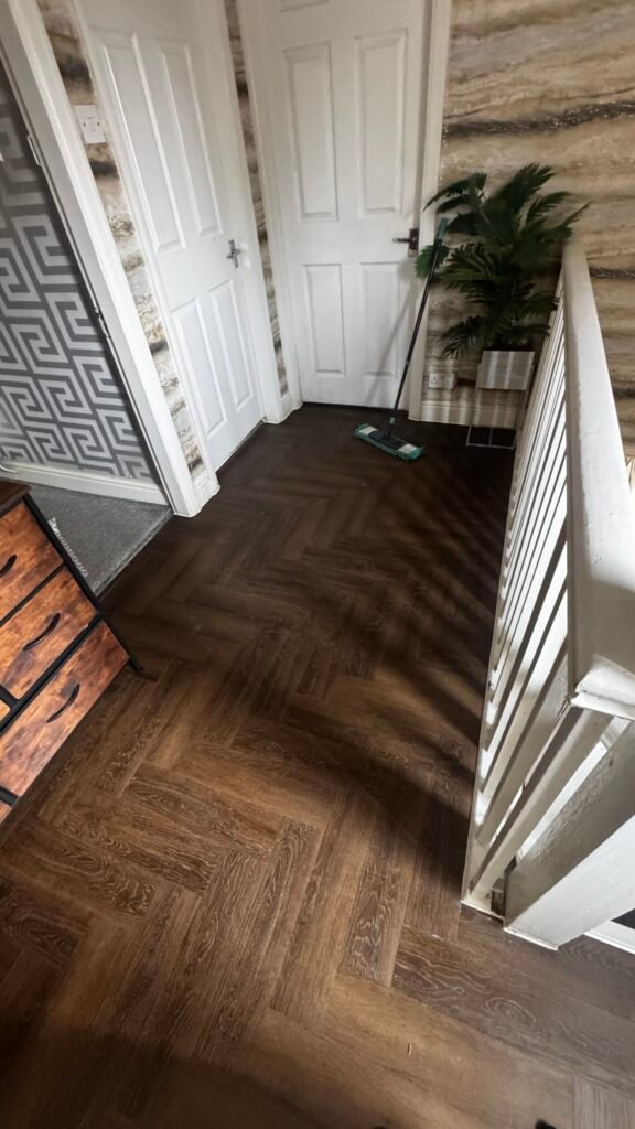 Nordikka dark oak herringbone LVT fitted on an upstairs landing